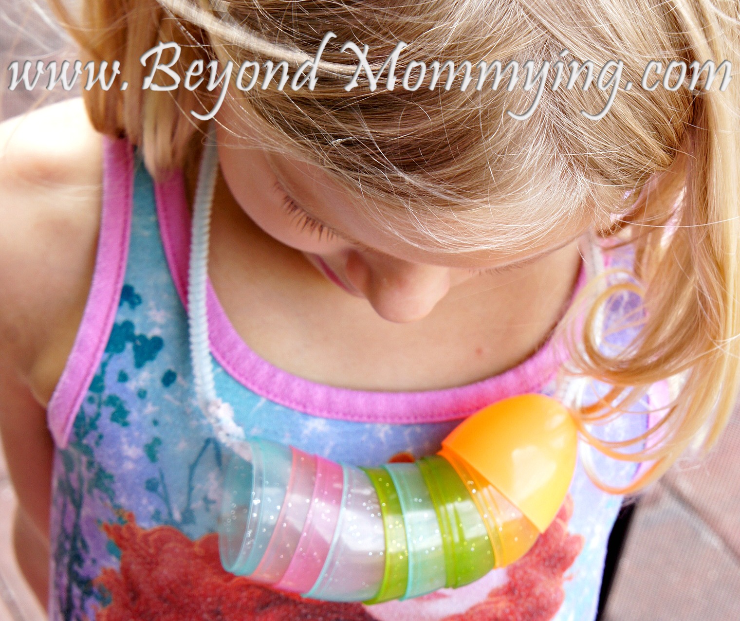 Using plastic Easter eggs and pipe cleaners to make "egg-laces"