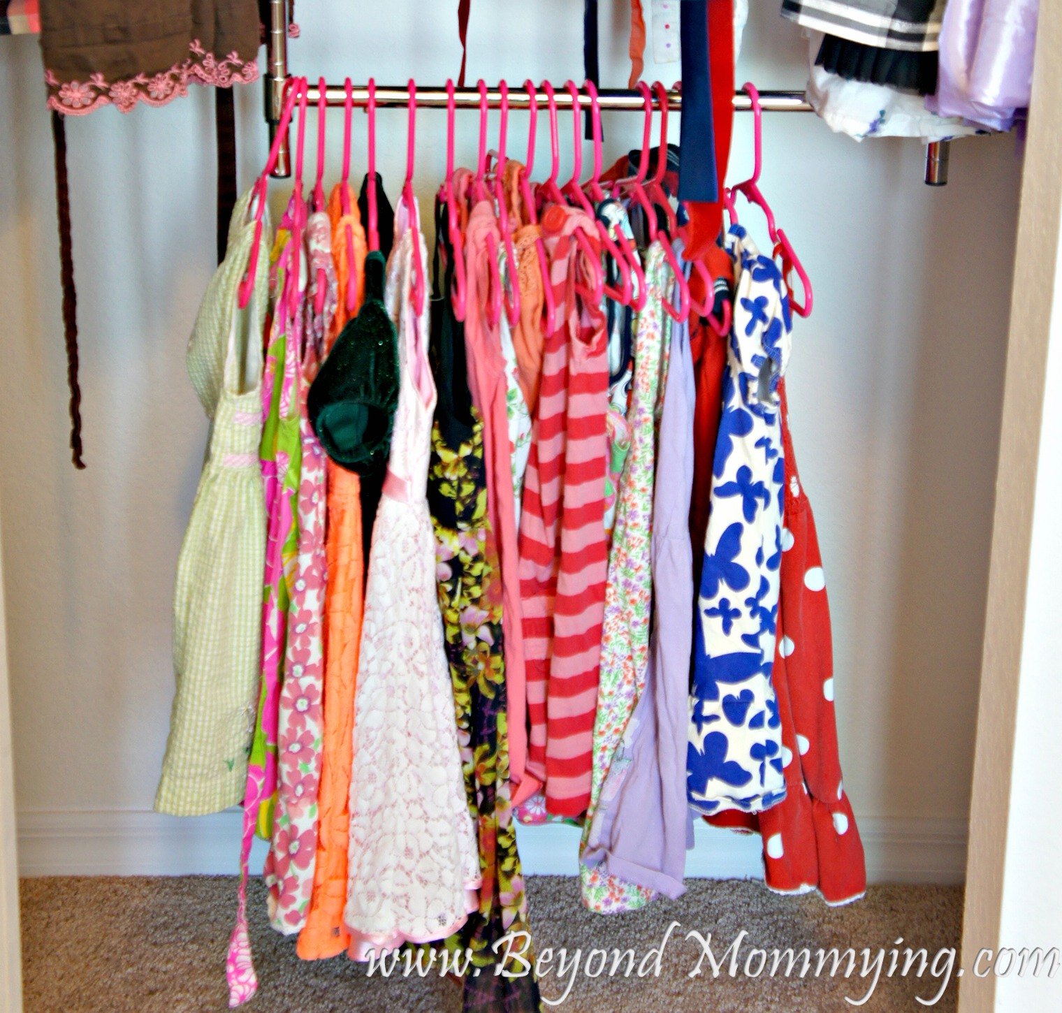 Use a double hanging rod to help kids manages their own hanging clothes