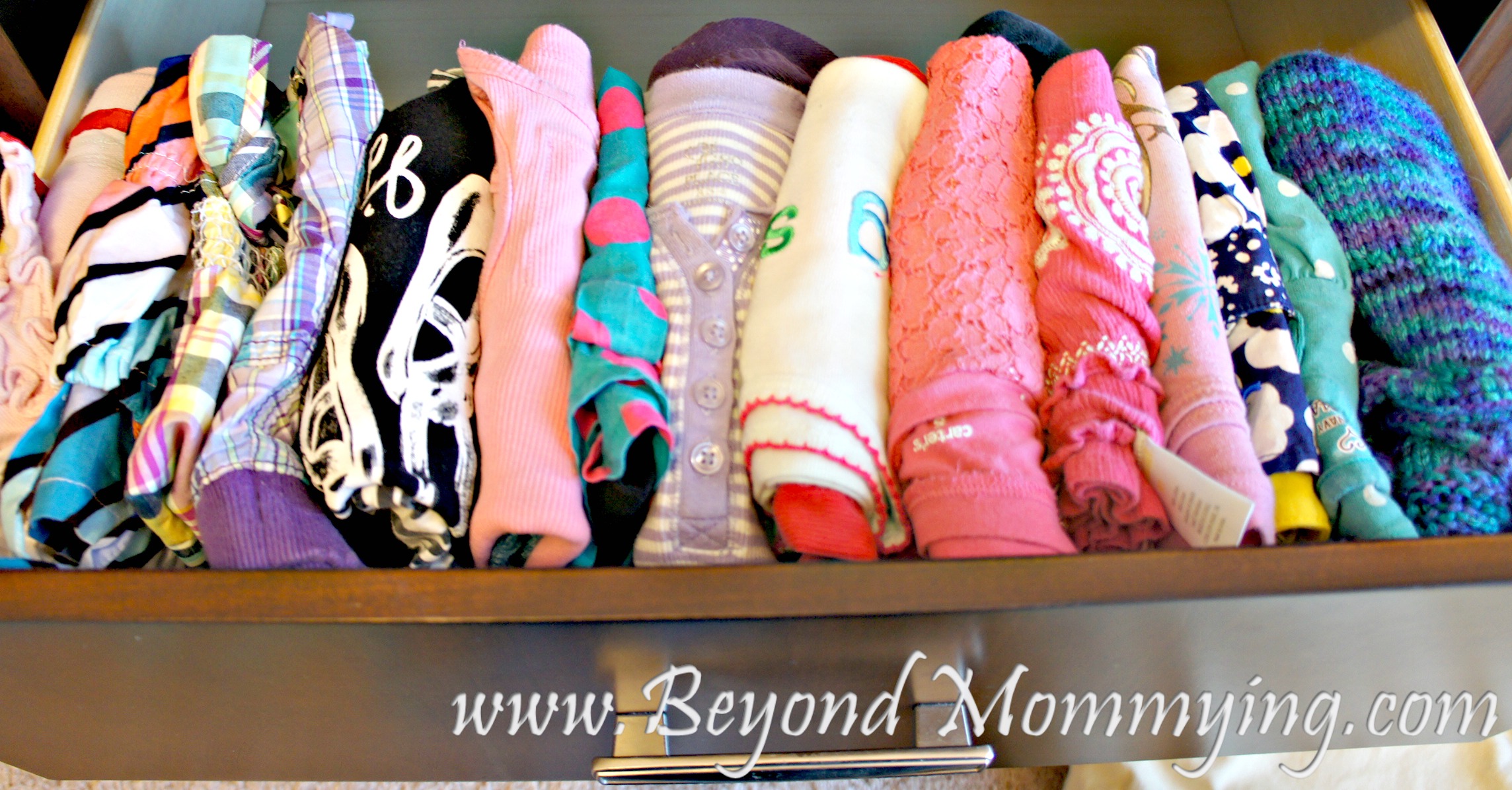 Keep kid's drawers tidy by folding outfits together and lining them up rather than stacking